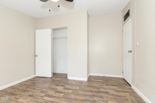 1201 Red Sunset Pl, Siler City, NC 27344 - unfurnished bedroom featuring a closet, visible vents, wood finished floors, and baseboards