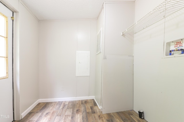 1201 Red Sunset Pl, Siler City, NC 27344 - washroom with electric panel, laundry area, wood finished floors, and baseboards
