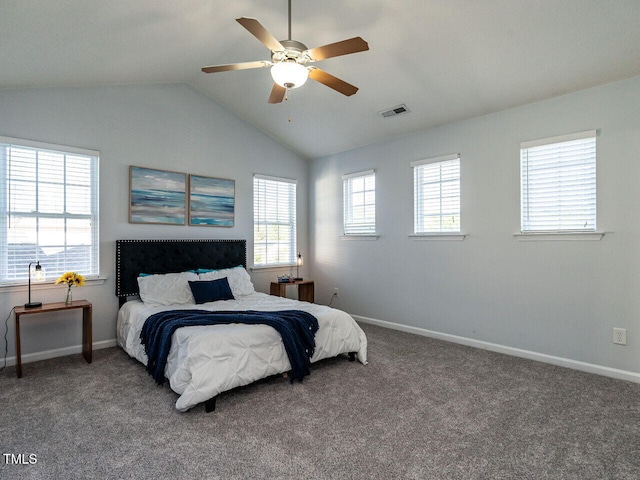 carpeted bedroom featuring vaulted ceiling, baseboards, and a ceiling fan