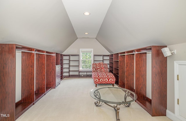 living area featuring recessed lighting, lofted ceiling, and light carpet
