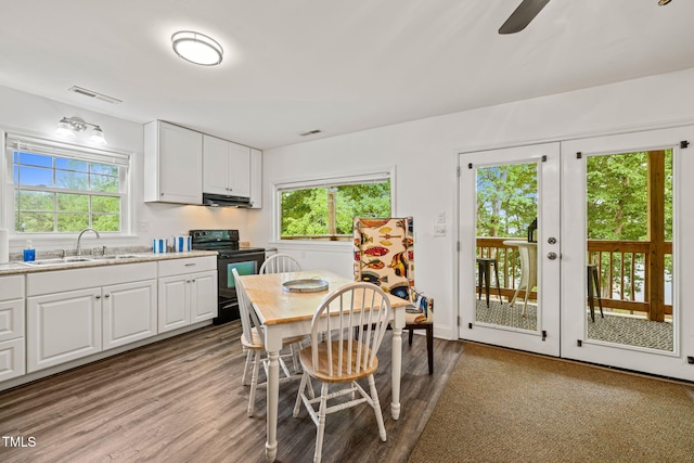 dining room with visible vents, a wealth of natural light, and light wood-style floors