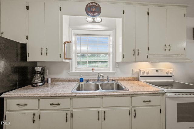kitchen featuring exhaust hood, white electric stove, a sink, light countertops, and white cabinetry