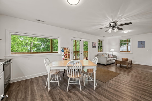 dining room featuring baseboards, visible vents, dark wood-style floors, and french doors