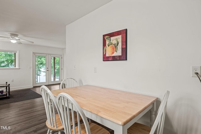 dining area with french doors, baseboards, ceiling fan, and dark wood-style floors