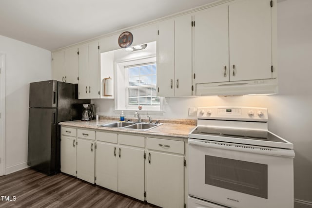 kitchen featuring white electric stove, a sink, freestanding refrigerator, dark wood-style floors, and under cabinet range hood