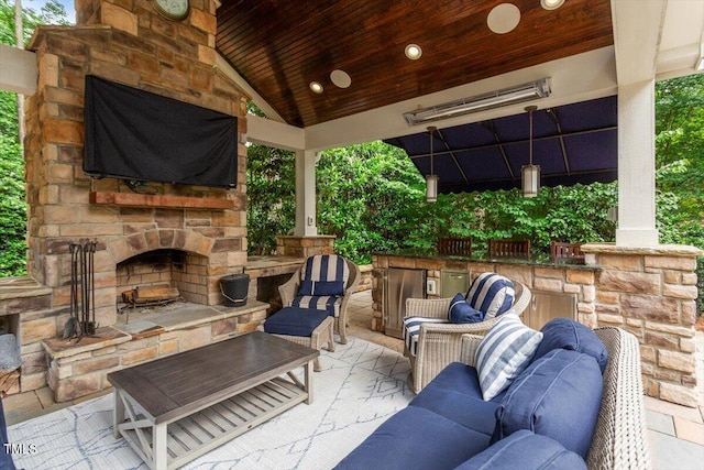 view of patio / terrace featuring an outdoor living space with a fireplace