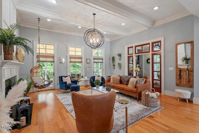 living area featuring beam ceiling, crown molding, wood finished floors, a chandelier, and a fireplace
