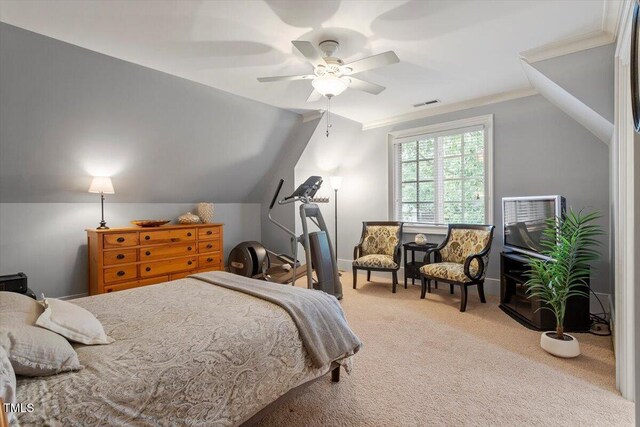 carpeted bedroom with vaulted ceiling and a ceiling fan
