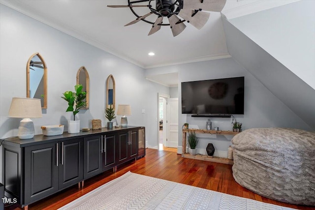 bedroom featuring wood finished floors, recessed lighting, ornamental molding, and baseboards