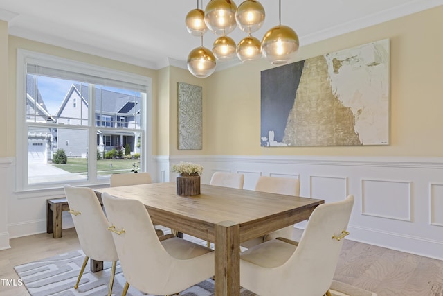 dining room with a wainscoted wall and a decorative wall