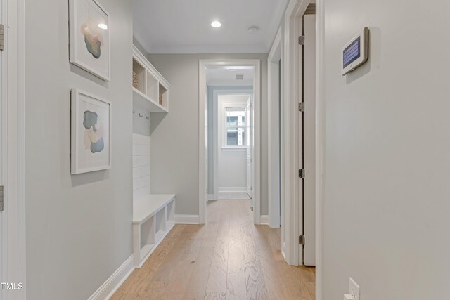 mudroom featuring light wood-type flooring, recessed lighting, and baseboards