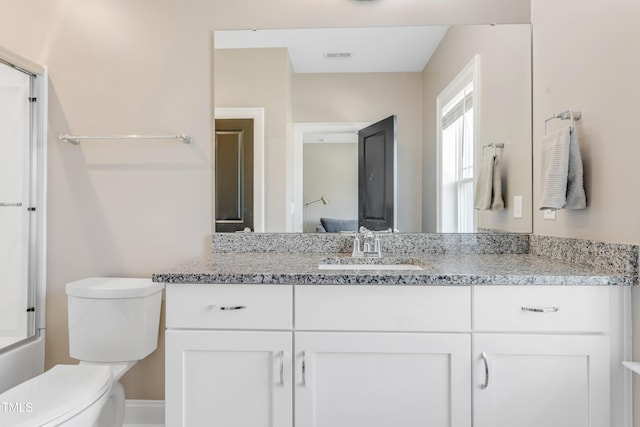 full bathroom with toilet, visible vents, and vanity