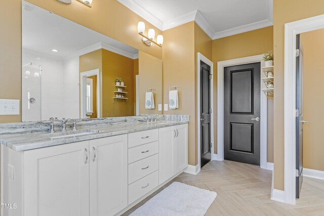 bathroom with crown molding, double vanity, baseboards, recessed lighting, and a sink