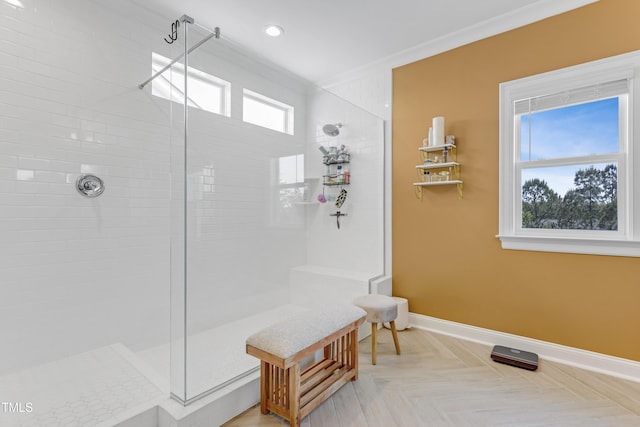 full bath with baseboards, recessed lighting, and a tile shower