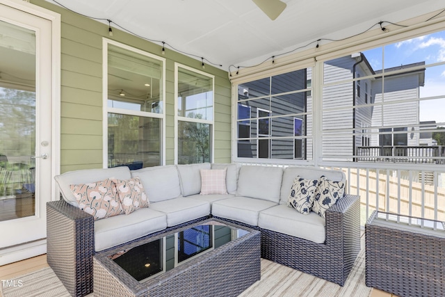 wooden deck with a baseboard heating unit and an outdoor hangout area