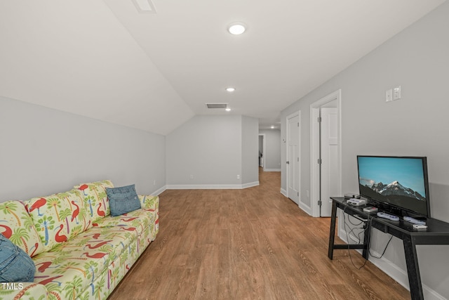 living room featuring recessed lighting, baseboards, wood finished floors, vaulted ceiling, and visible vents