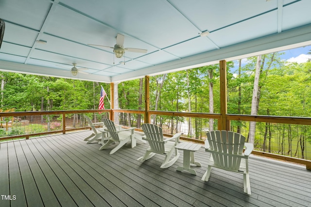 wooden deck featuring ceiling fan