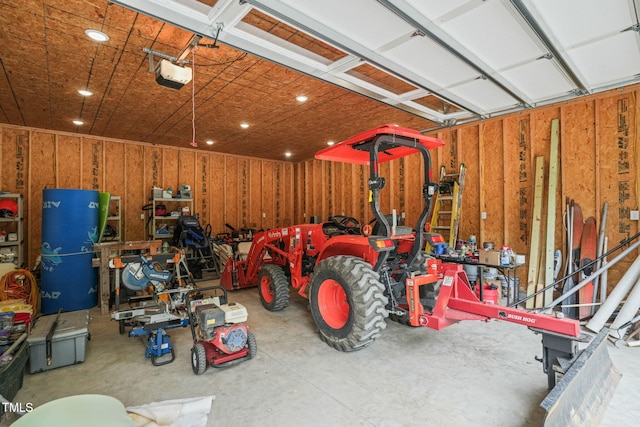 garage featuring recessed lighting and a garage door opener