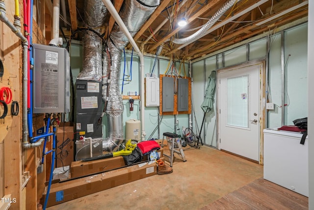 unfinished below grade area featuring washer / clothes dryer, electric panel, and refrigerator