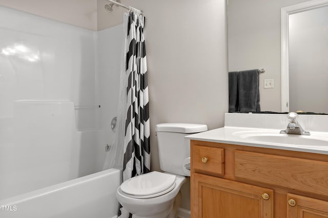 bathroom with vanity, shower / bathtub combination with curtain, and toilet