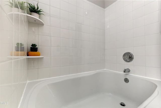full bath featuring a bath
