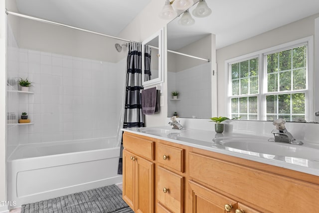 full bath with double vanity, shower / tub combination, a sink, and tile patterned flooring