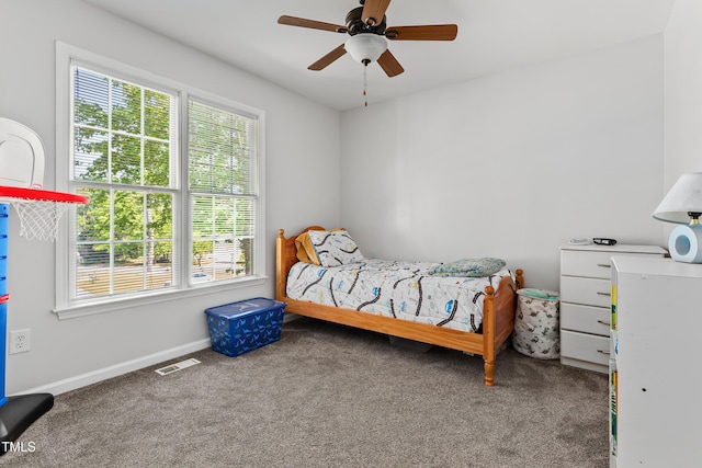 bedroom with visible vents, carpet flooring, baseboards, and ceiling fan