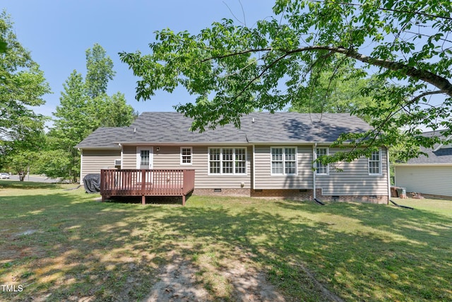 back of house featuring a wooden deck, a yard, and crawl space
