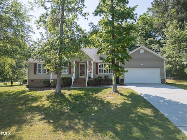view of front of property with an attached garage, concrete driveway, and a front yard