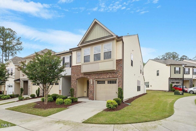 townhome / multi-family property featuring brick siding, board and batten siding, an attached garage, driveway, and a front yard