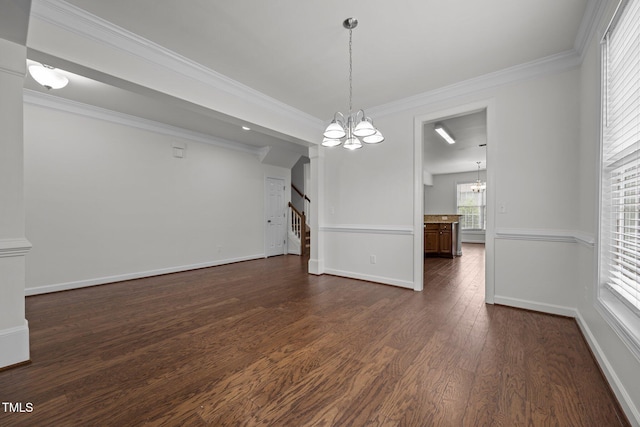 333 Trout Valley Rd, Wake Forest, NC 27587 - unfurnished dining area featuring a chandelier, stairs, dark wood-type flooring, and ornamental molding