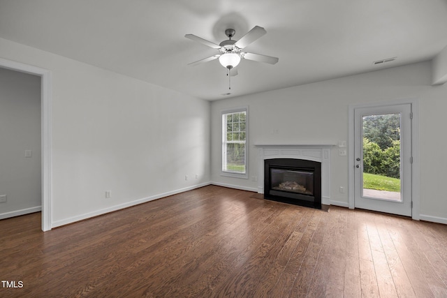 333 Trout Valley Rd, Wake Forest, NC 27587 - unfurnished living room with ceiling fan, wood finished floors, and a fireplace with flush hearth