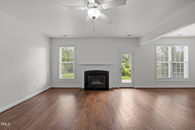 333 Trout Valley Rd, Wake Forest, NC 27587 - unfurnished living room featuring a fireplace with flush hearth, wood finished floors, and ceiling fan