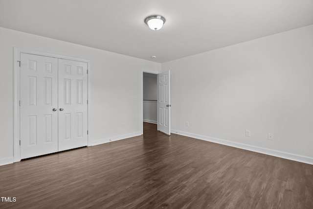 333 Trout Valley Rd, Wake Forest, NC 27587 - unfurnished bedroom featuring dark wood-style flooring and a closet
