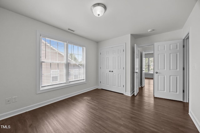333 Trout Valley Rd, Wake Forest, NC 27587 - unfurnished bedroom featuring dark wood-type flooring and a closet