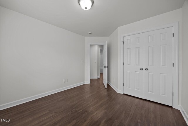 333 Trout Valley Rd, Wake Forest, NC 27587 - unfurnished bedroom with dark wood-style floors and a closet