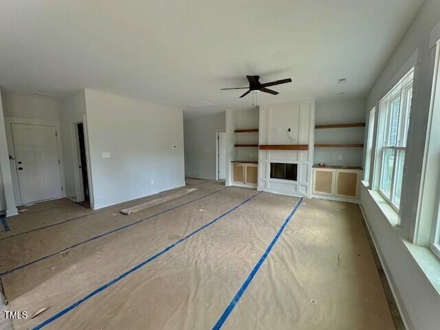 297 Dry Branch Dr, Kenly, NC 27542 - unfurnished living room featuring ceiling fan