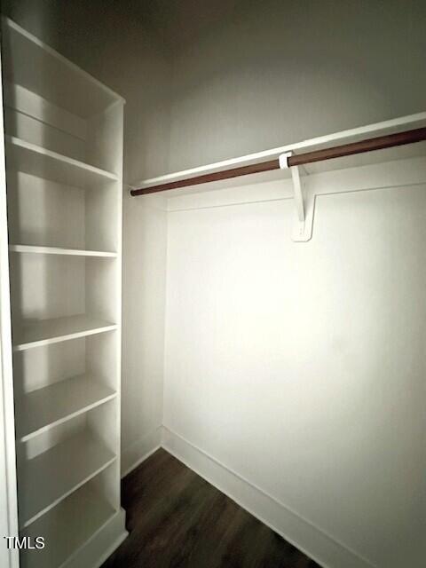 297 Dry Branch Dr, Kenly, NC 27542 - spacious closet featuring dark wood-style floors