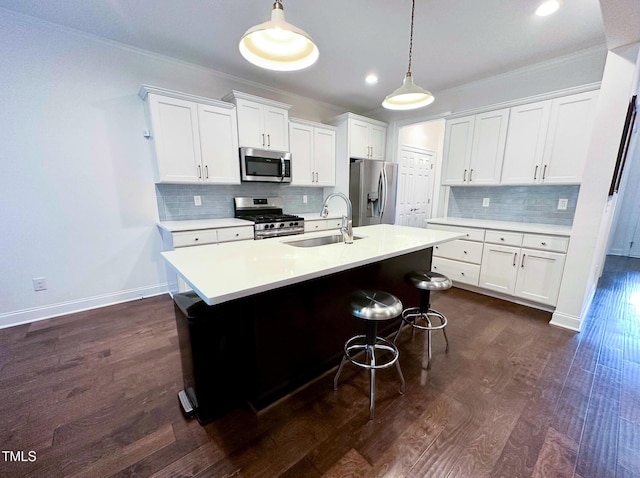 409 Eagle Ct, Henderson, NC 27536 - kitchen featuring pendant lighting, tasteful backsplash, a sink, light countertops, and stainless steel appliances