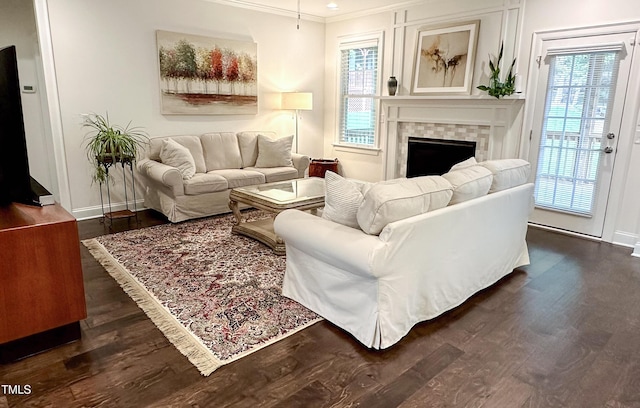 409 Eagle Ct, Henderson, NC 27536 - living area with crown molding, baseboards, a fireplace, and dark wood finished floors
