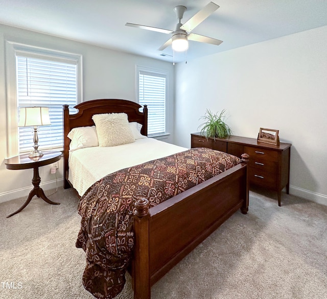 409 Eagle Ct, Henderson, NC 27536 - carpeted bedroom featuring a ceiling fan and baseboards