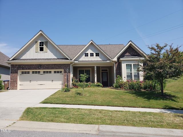 craftsman house with brick siding, board and batten siding, and concrete driveway