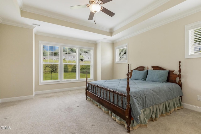 624 Meadowgrass Ln, Wake Forest, NC 27587 - bedroom featuring a tray ceiling, ornamental molding, carpet flooring, baseboards, and a ceiling fan
