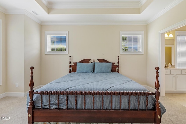 624 Meadowgrass Ln, Wake Forest, NC 27587 - bedroom with a tray ceiling, light colored carpet, ornamental molding, connected bathroom, and baseboards