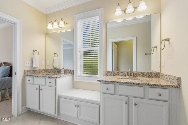 624 Meadowgrass Ln, Wake Forest, NC 27587 - ensuite bathroom with ornamental molding, two vanities, and tile patterned flooring