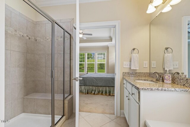 624 Meadowgrass Ln, Wake Forest, NC 27587 - ensuite bathroom with a stall shower, ornamental molding, vanity, tile patterned floors, and ceiling fan