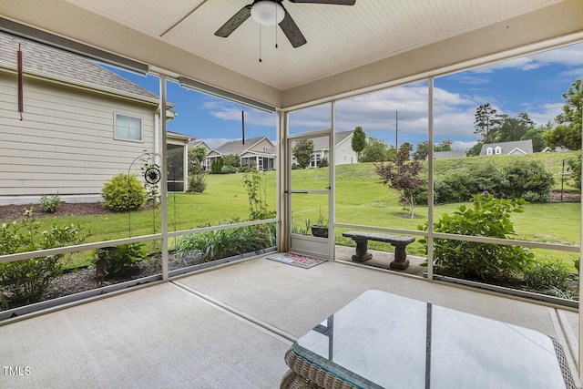 624 Meadowgrass Ln, Wake Forest, NC 27587 - unfurnished sunroom with a ceiling fan and a residential view