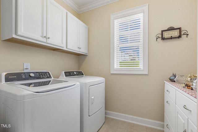 624 Meadowgrass Ln, Wake Forest, NC 27587 - laundry room with cabinet space, separate washer and dryer, crown molding, baseboards, and light tile patterned flooring