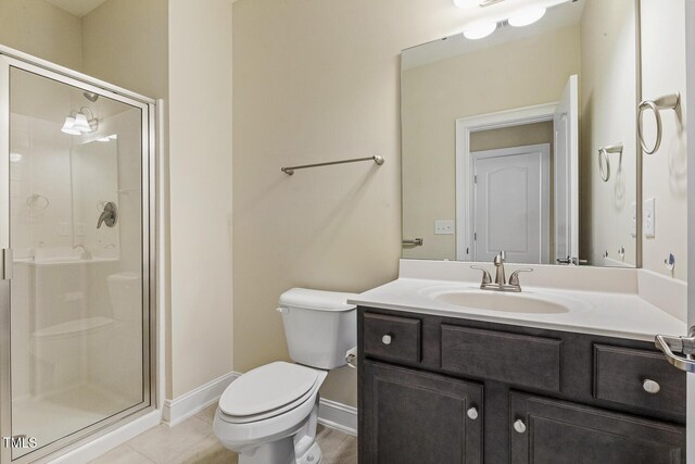 624 Meadowgrass Ln, Wake Forest, NC 27587 - bathroom with toilet, a stall shower, vanity, and baseboards