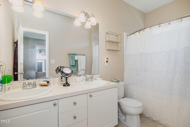 209 Mccarthy Dr, Clayton, NC 27527 - bathroom featuring double vanity, toilet, tile patterned floors, and a shower with shower curtain
